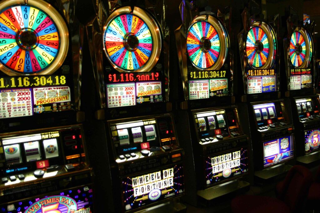 Row of Wheel of Fortune slot machines.